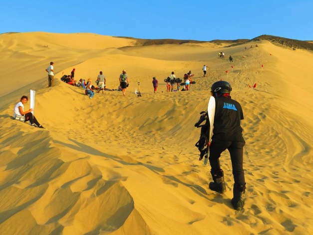 Sandboarding in Lima's Dunes