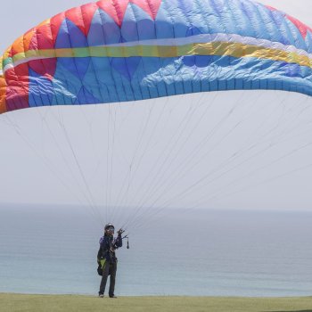 Fly in a paraglider over the Lima coast