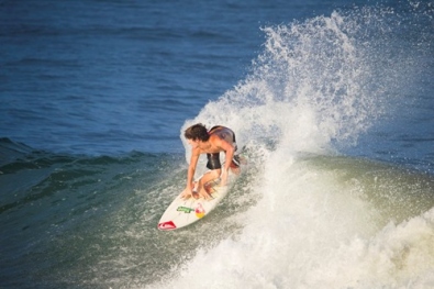 Surfing at Mejía Beach